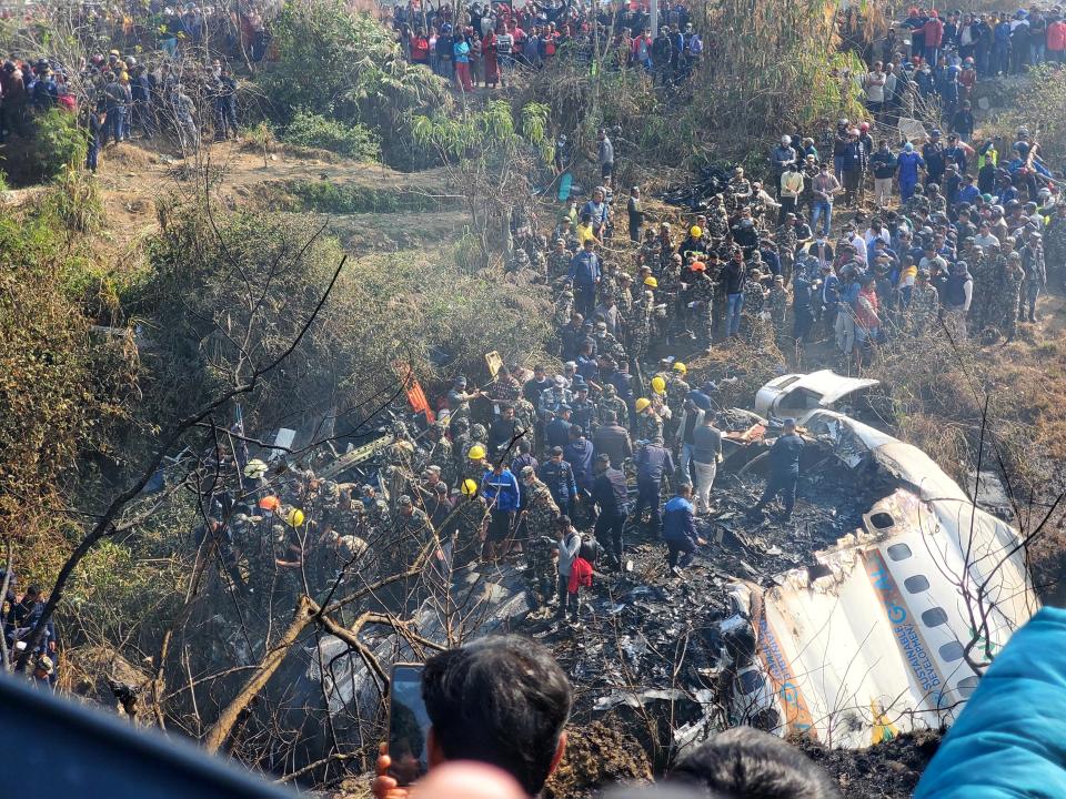 A general view of people gathered after the plane crash in Pokhara, Nepal January 15, 2023 in this picture obtained from social media