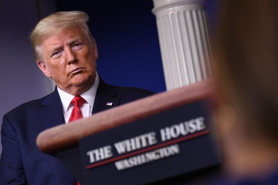 US President Donald Trump listens during the daily briefing on the novel coronavirus, COVID-19, at the White House on March 22, 2020, in Washington, DC.