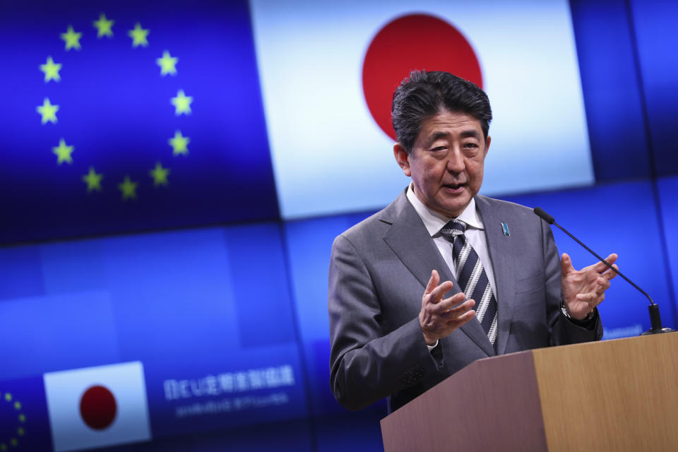 Japan's Prime Minister Shinzo Abe talks to journalists during a joint news conference with European Commission President Jean-Claude Juncker and European Council President Donald Tusk following their meeting during an EU-Japan summit at the European Council headquarters in Brussels, Thursday, April 25, 2019. Japanese Prime Minister Shinzo Abe and top EU officials discussed trade, bilateral ties and North Korea. (AP Photo/Francisco Seco)