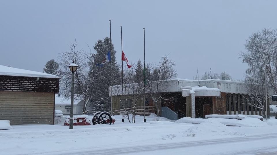 Flags were lowered in Fort Smith in the wake of last week's fatal plane crash. (Travis Burke/CBC - image credit)