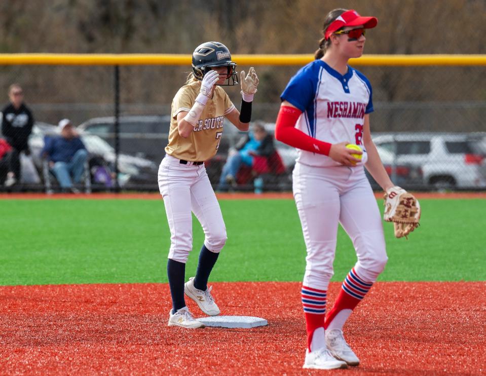 Council Rock South's Helen Woloshyn (7) and Neshaminy's Morgan Leonhauser (26) react to the official's call of Helen Woloshyn's attempt to steal second base safe during their softball game in Langhorne on Tuesday, March 26, 2024.