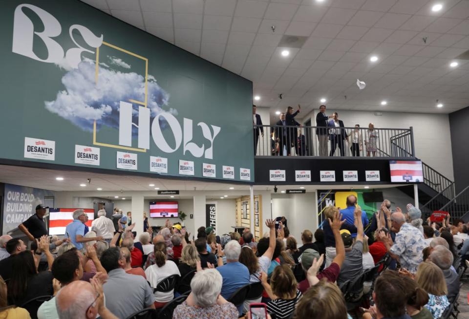 <div class="inline-image__caption"><p>Florida Governor Ron Desantis throws a campaign hat down to supporters next to a large mural reading "Be Holy" as he kicks off his campaign for the 2024 Republican U.S. presidential nomination with an evening campaign rally at the evangelical Eternity church in West Des Moines, Iowa. </p></div> <div class="inline-image__credit">Scott Morgan/Reuters</div>