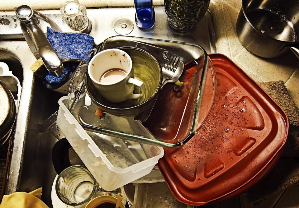 There are some simple steps you can teach your kids to avoid having a sink that looks like this. (Photo: Getty Images)