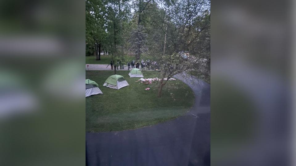 Student protesters set up tents at a private residence