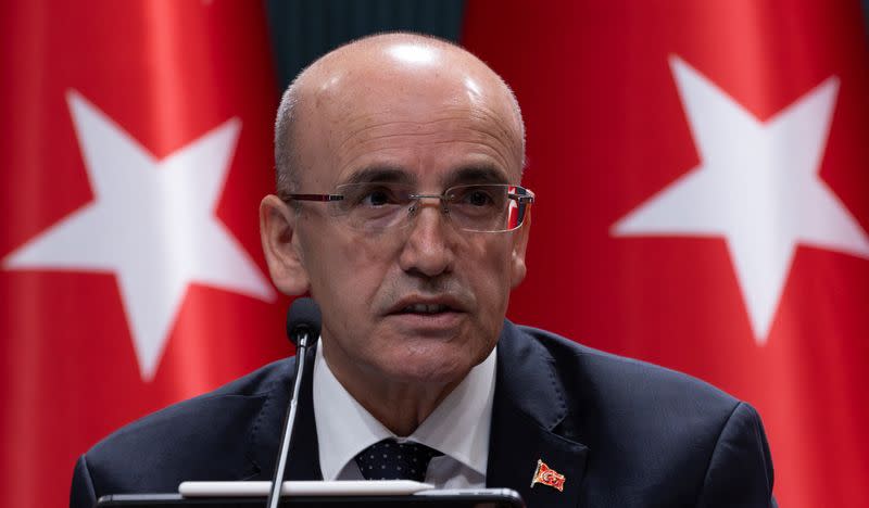 Turkey's Finance Minister Mehmet Simsek announces a savings measures package in Ankara