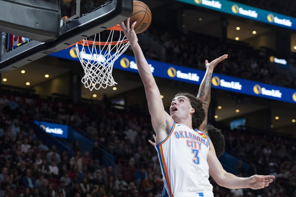 Oklahoma City Thunder's Josh Giddey (3) scores against the Detroit Pistons during the first half of an NBA preseason basketball game Thursday, Oct. 12, 2023, in Montreal. (Christinne Muschi/The Canadian Press via AP)