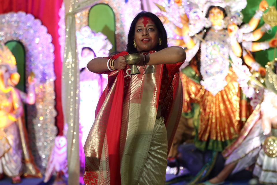 Dalia Karmakar, of Wallington, performs a dhunuchi dance,  during Sharadotsav 2022, in Bergenfield. The dance is   performed to thank Goddess Durga.  Sunday, October 2, 2022