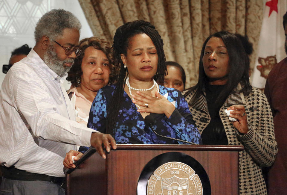 FILE - In this March 12, 2019 file photo Oakland City Councilwoman Lynette McElhaney, the mother of Victor McElhaney, 21, a University of Southern California student killed during an attempted robbery, talks about her son during a news conference on the USC campus in Los Angeles. A suspected gang member has been charged with killing of Victor McElhaney during an off-campus robbery attempt. The Los Angeles County District Attorney's Office says 23-year-old Ivan Hernandez was charged Tuesday, July 2, 2019, with one count of murder during an attempted robbery and murder while being an active participant in a criminal street gang. (AP Photo/Reed Saxon, File)