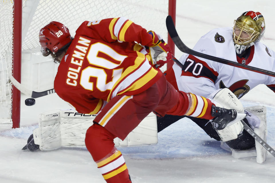 Calgary Flames' Blake Coleman scores against Ottawa Senators goalie Joonas Korpisalo during the third period of an NHL hockey game Tuesday, Jan. 9, 2024, in Calgary, Alberta. (Larry MacDougal/The Canadian Press via AP)