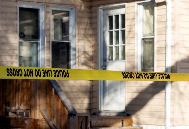 Police were on scene investigating an adult man’s death on the 1000 block of Garnet Street on Sunday morning. Three men have now been charged in connection with the death of Justin Robert Delorme, 32. (Bryan Eneas/CBC - image credit)
