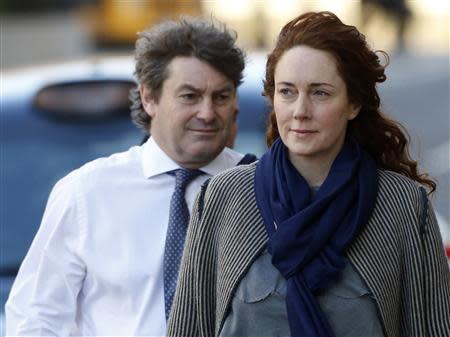 Former News International chief executive Rebekah Brooks and her husband Charlie Brooks arrive at the Old Bailey courthouse in London February 21, 2014. REUTERS/Luke MacGregor