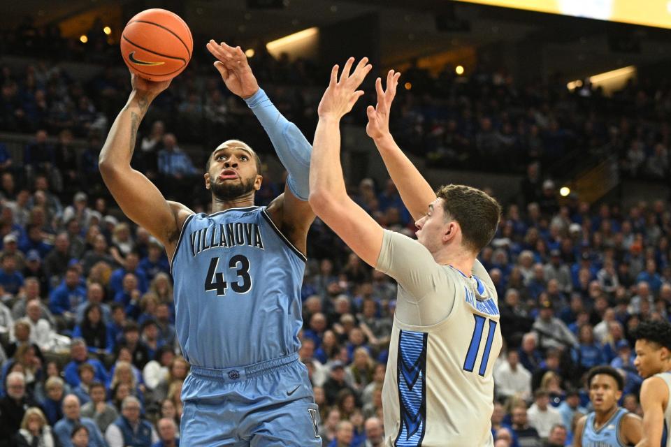 Villanova forward Eric Dixon (43) goes in for a basket against Creighton center Ryan Kalkbrenner during the Wildcats' overtime victory last week.