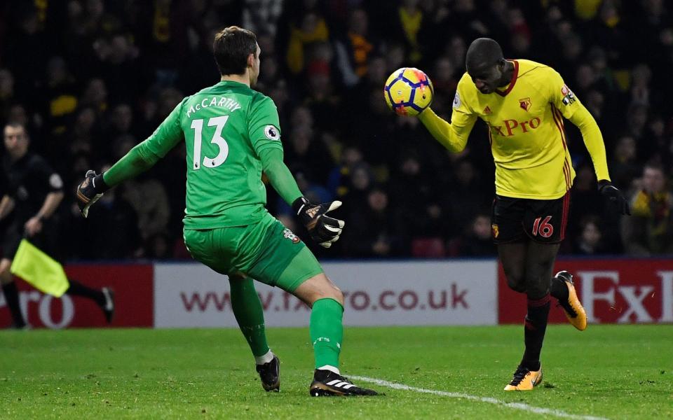 Abdoulaye Doucoure handles the ball towards the goal line