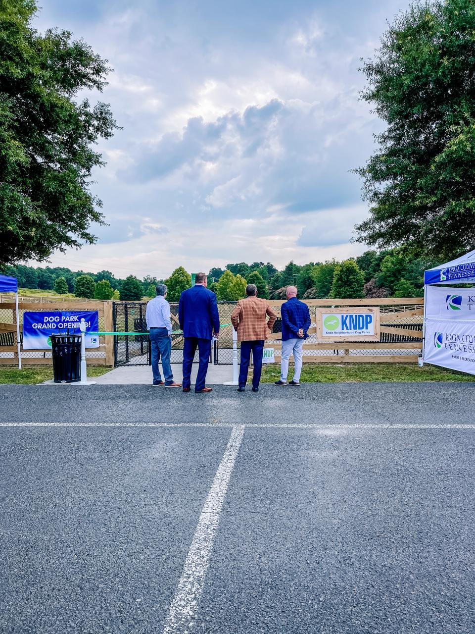 Knox County’s Mike Donila, Mayor Glenn Jacobs, Randy Boyd and Harrison Forbes, The Boyd Foundation’s grant coordinator for Knox Dog Parks, take a look at the completed Beverly Park dog park on June 29, 2022.
