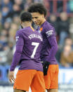 Manchester City's Raheem Sterling, left, celebrates with his teammate Leroy Sane, after scoring his team's second goal, during the English Premier League soccer match between Huddersfield Town and Manchester City at John Smith's stadium in Huddersfield, England, Sunday, Jan. 20, 2019. (AP Photo/Rui Vieira)