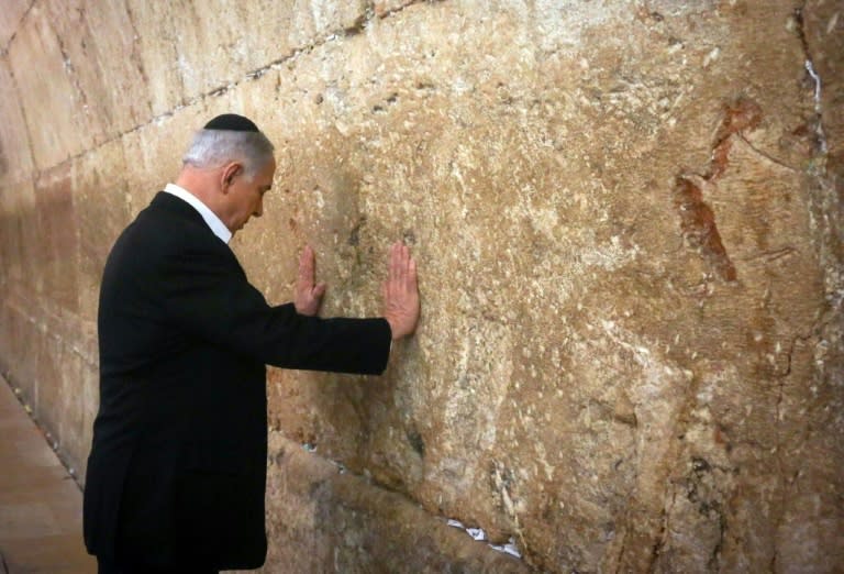 Israeli Prime Minister Benjamin Netanyahu prays at the Western Wall on February 28, 2015