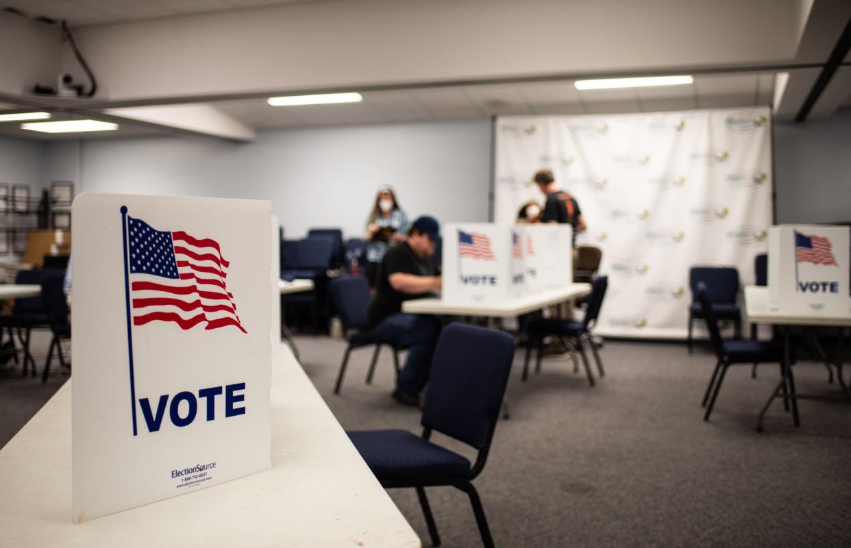 People vote at the Merdian Township Town Hall, Tuesday, Aug. 2, 2022, in Meridian Township.