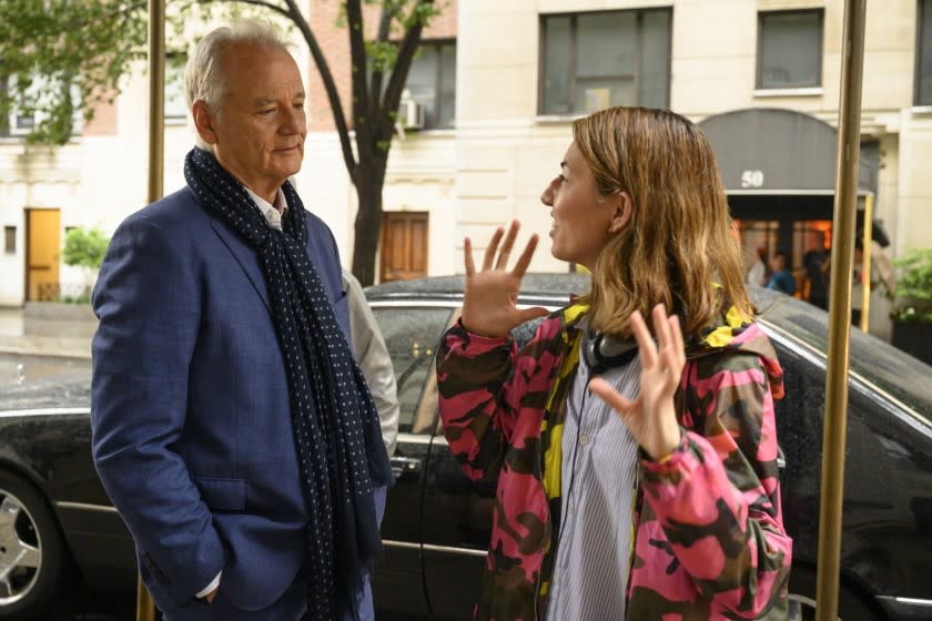 Bill Murray listens to writer-director Sofia Coppola during the making of "On the Rocks," now streaming on Apple TV+.