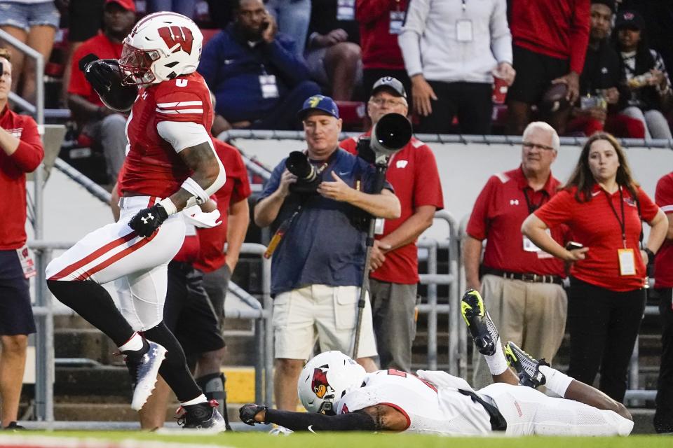 Wisconsin's Braelon Allen (0) gets past Illinois State's Franky West (7) for a 96-yard touchdown run during the first half of an NCAA college football game Saturday, Sept. 3, 2022, in Madison, Wis. (AP Photo/Morry Gash)