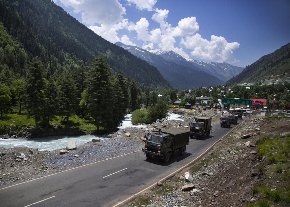 An Indian army convoy moves on the Srinagar- Ladakh highway at Gagangeer, northeast of Srinagar, India, Wednesday, June 17, 2020. Indian security forces said neither side fired any shots in the clash in the Ladakh region Monday that was the first deadly confrontation on the disputed border between India and China since 1975. China said Wednesday that it is seeking a peaceful resolution to its Himalayan border dispute with India following the death of 20 Indian soldiers in the most violent confrontation in decades. (AP Photo/Mukhtar Khan)