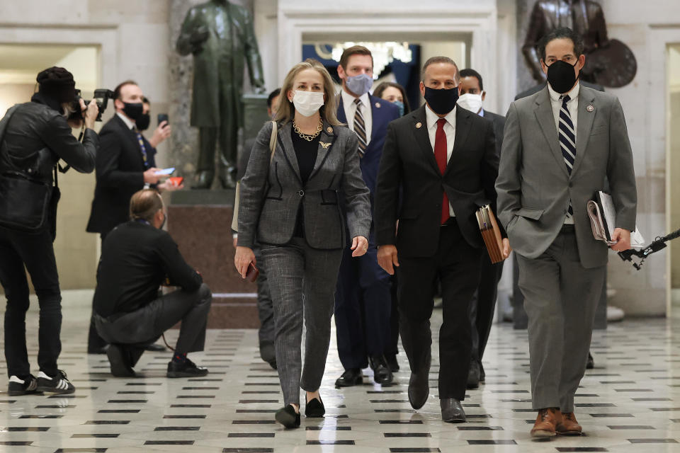 Impeachment managers (L-R) Rep. Madeleine Dean (D-PA), Rep. Eric Swalwell (D-CA), Rep. David Cicilline (D-RI), Rep. Jamie Raskin (D-MD) and others walk through Statuary Hall while heading to vote to impeach U.S. President Donald Trump for the second time in little over a year in the House Chamber of the U.S. Capitol January 13, 2021 in Washington, DC. The House voted 232-197 to impeach Trump on the charge of â€œincitement of insurrection