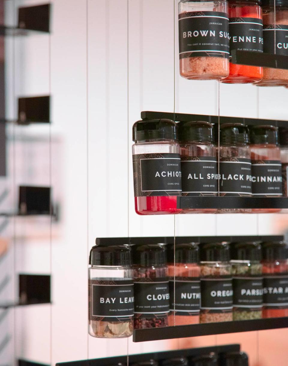 “A Spectrum of Blackness” by artist Germane Barnes includes a floating spice rack of ingredients used by African American and Black immigrant communities. The work was exhibited at the Museum of Modern Art in New York City.