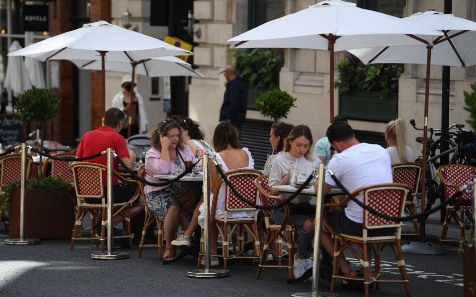 Diners and drinkers have been able to remain outside at pubs and restaurants - something that will be markedly more difficult when the cold weather descends - NEIL HALL/EPA-EFE/Shutterstock 