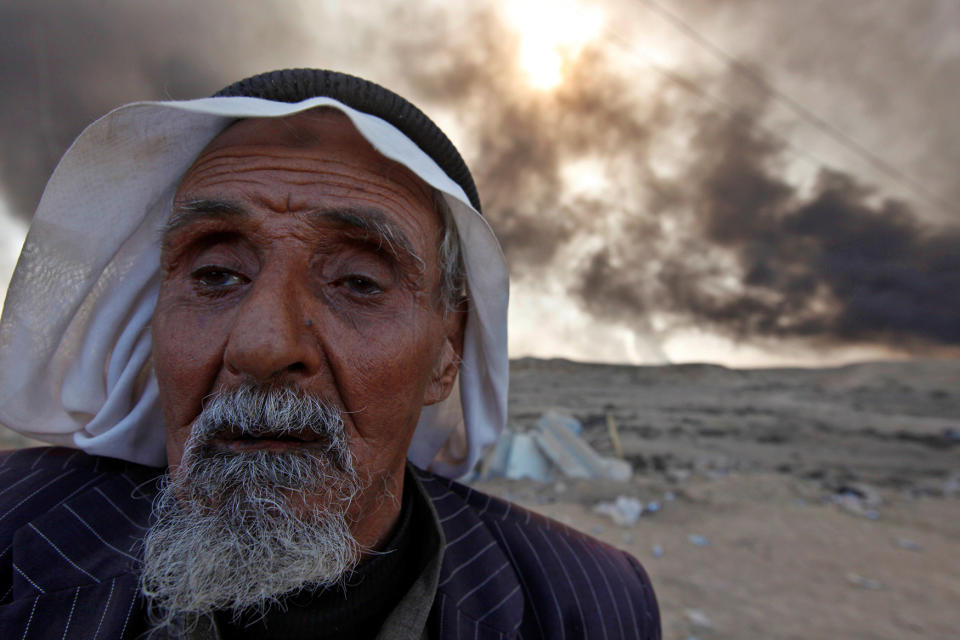 A man returns to his village after it was liberated