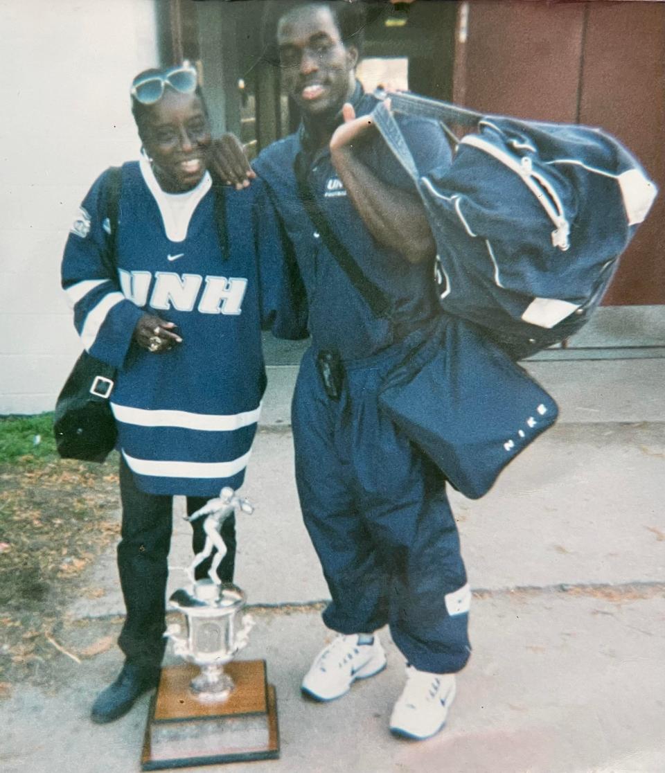 Stefan Lewis stands with his mother, Cheryl, after one of Lewis' football games at UNH. Cheryl Lewis never missed a game, driving from her home in Pennsylvania every week.