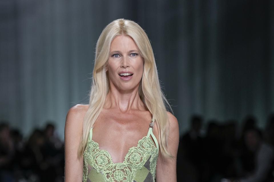 Claudia Schiffer wears a creation as part of the Versace women's Spring Summer 2024 collection presented in Milan, Italy, Friday, Sept. 22, 2023. (AP Photo/Antonio Calanni)