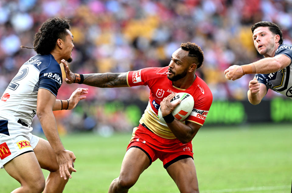 BRISBANE, AUSTRALIA - MARCH 10: Hamiso Tabuai-Fidow of the Dolphins pushes away the defence during the round one NRL match between the Dolphins and North Queensland Cowboys at Suncorp Stadium, on March 10, 2024, in Brisbane, Australia. (Photo by Bradley Kanaris/Getty Images)