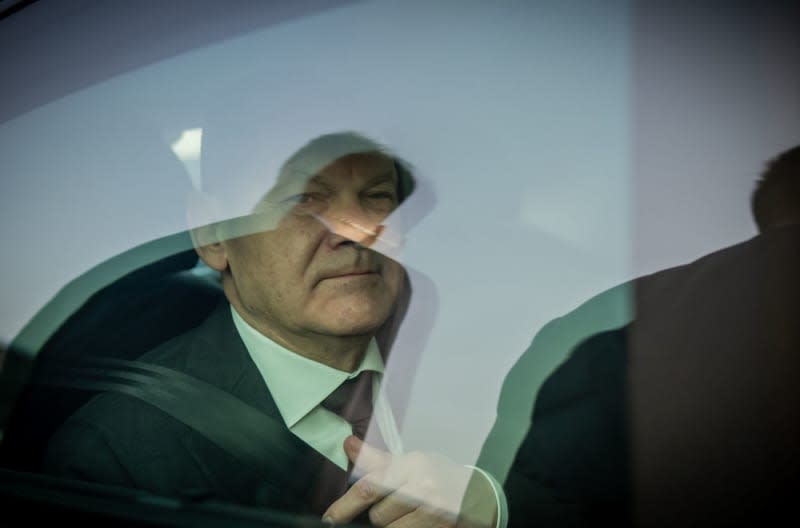 German Chancellor Olaf Scholz sits in a limousine after arriving in Chongqing. Scholz's trip to Chongqing, Shanghai and Beijing will focus on economic relations with the world's second-largest economy, the war in Ukraine, the conflict over Taiwan and the human rights situation in China. Michael Kappeler/dpa