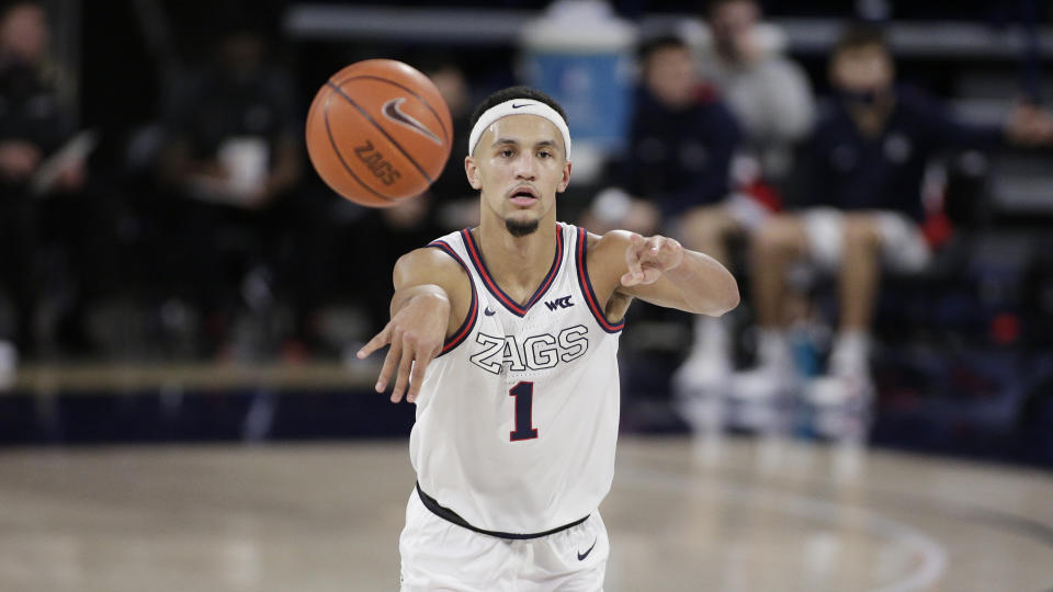 Gonzaga guard Jalen Suggs passes the ball during the first half of an NCAA college basketball game against Saint Mary's in Spokane, Wash., Thursday, Feb. 18, 2021. (AP Photo/Young Kwak)