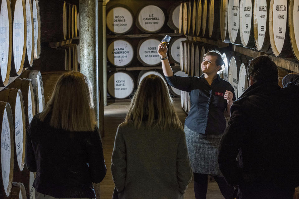 People are guided during a cellar tour of the Dewar’s Distillery in Aberfeldy, the Scottish Highlands, in 2018, where they have produced Scotch whisky since 1898, and offer traditional whisky tastings, and a whisky and chocolate tasting tour. Many people now like to know more about their food and drink and where it comes from, leading to a boom in so-called "spirit tourism" in Britain, with artisan brands and micro distilleries popping up across the country. (Bacardi Limited via AP)