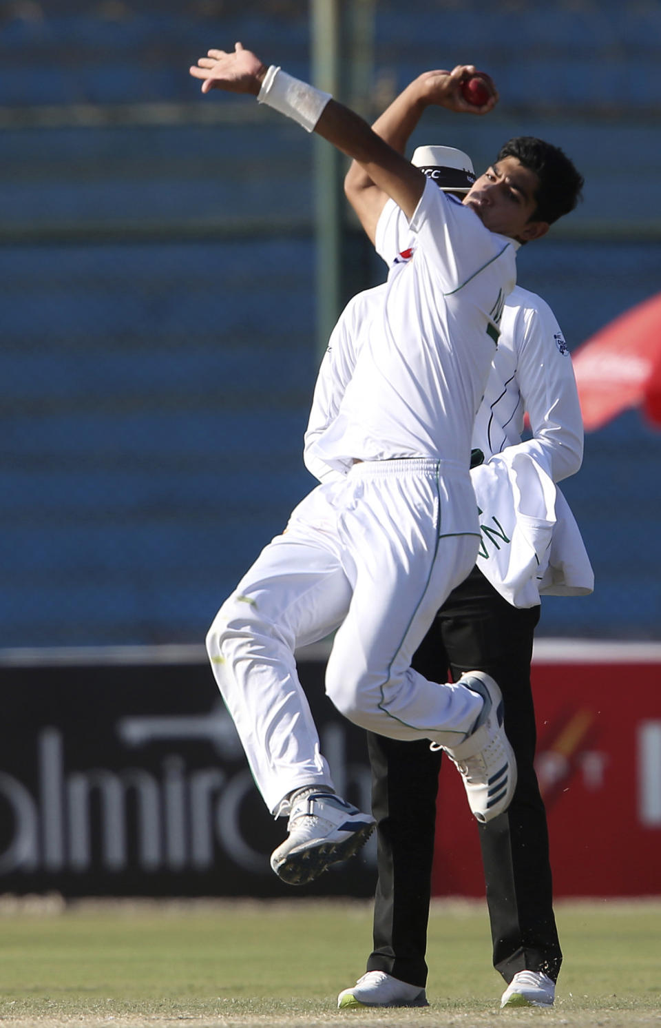 Pakistani bowler Naseem Shah in action against Sri Lanka during the second Test in Karachi, Pakistan, Sunday, Dec. 22, 2019. Pakistan continued to take the second test away from Sri Lanka with yet another record-making day, reaching 555-3 at lunch on the fourth day and pushing their lead to 475 runs. (AP Photo/Fareed Khan)