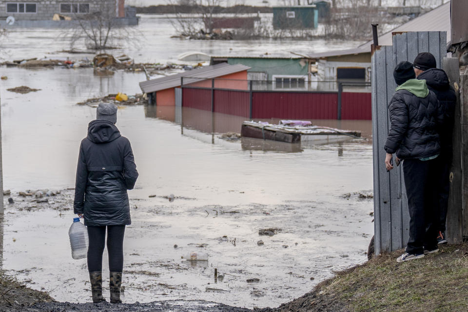 Residents survey a flooded area in Petropavl, Kazakhstan, April 13, 2024. / Credit: Turar Kazangapov/Anadolu/Getty