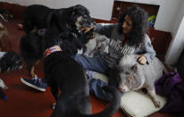 <p>Jair Luzan interacts with some of his pets as they relax in their temporary home in the aftermath of a 7.1-magnitude earthquake, in Mexico City, Friday, Sept. 22, 2017. (Photo: Natacha Pisarenko/AP) </p>