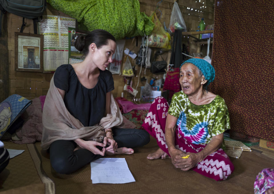 <p>Ange meets a 90-year-old woman in Myanmar, during her visit to Ja Mai Kaung Baptist refugee camp. Her son Maddox Jolie-Pitt took the photograph on July 30, 2015 in Myitkyina, Myanmar. Source: Getty </p>