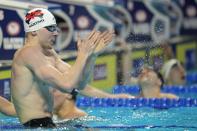 Zach Harting reacts after winning the men's 200 butterfly during wave 2 of the U.S. Olympic Swim Trials on Wednesday, June 16, 2021, in Omaha, Neb. (AP Photo/Jeff Roberson)