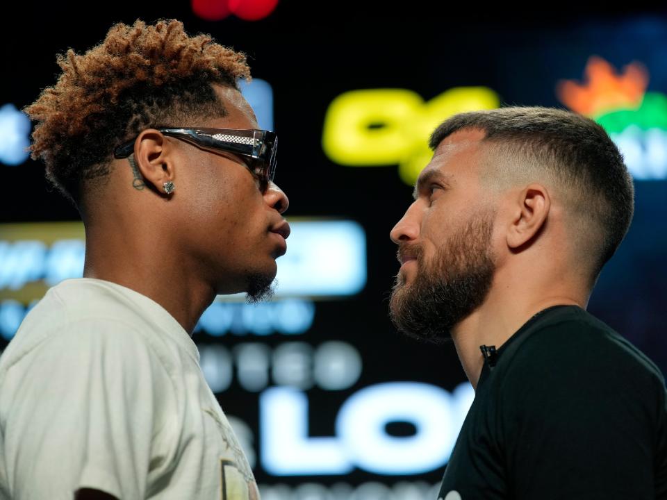 Devin Haney (left) faces off with Vasiliy Lomachenko ahead of their title fight (AP)