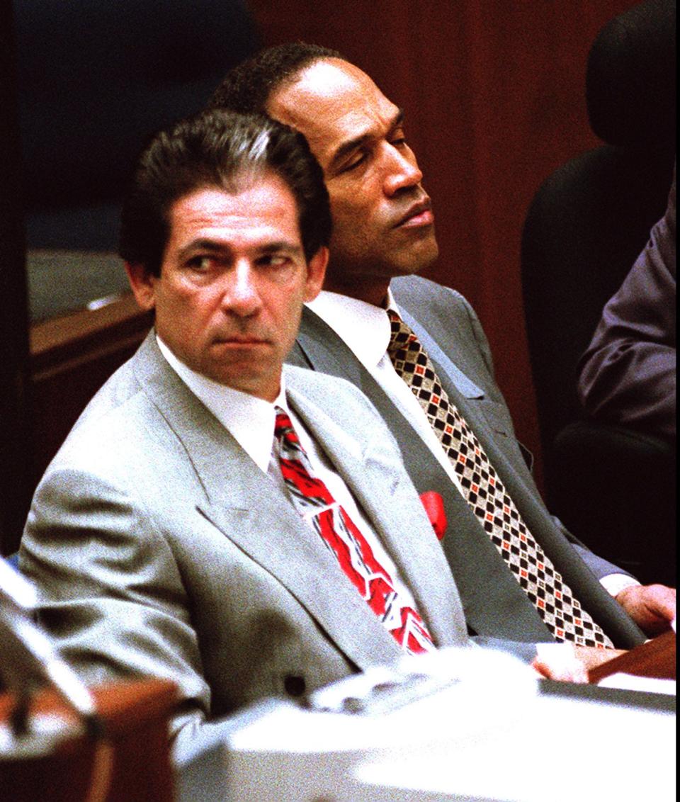 Robert Kardashian and O. J. Simpson during the former athlete's double-murder trial on June 7, 1995, in Los Angeles.