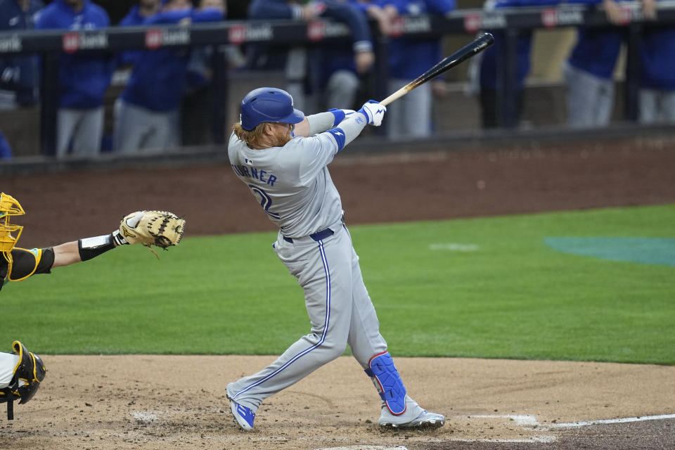 Toronto Blue Jays' Justin Turner watches his RBI single during the second inning of a baseball game against the San Diego Padres, Friday, April 19, 2024, in San Diego. (AP Photo/Gregory Bull)