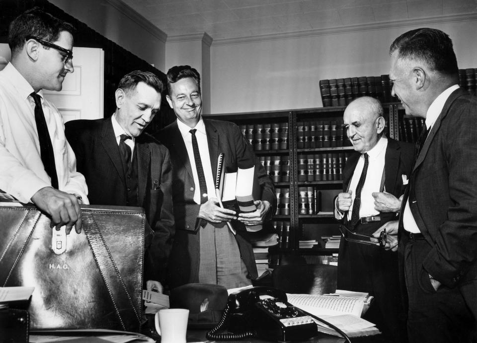 Five attorneys for a group of citizens seeking reapportionment of the Tennessee Legislature work over law books and briefs before their federal court hearing in May of 1962. They are, left to right, Harris Gilbert of Nashville, Hobart Atkins of Knoxville, Z.T. Osborn Jr. of Nashville, Walter Chandler of Memphis and C.R. McClain of Knoxville.
