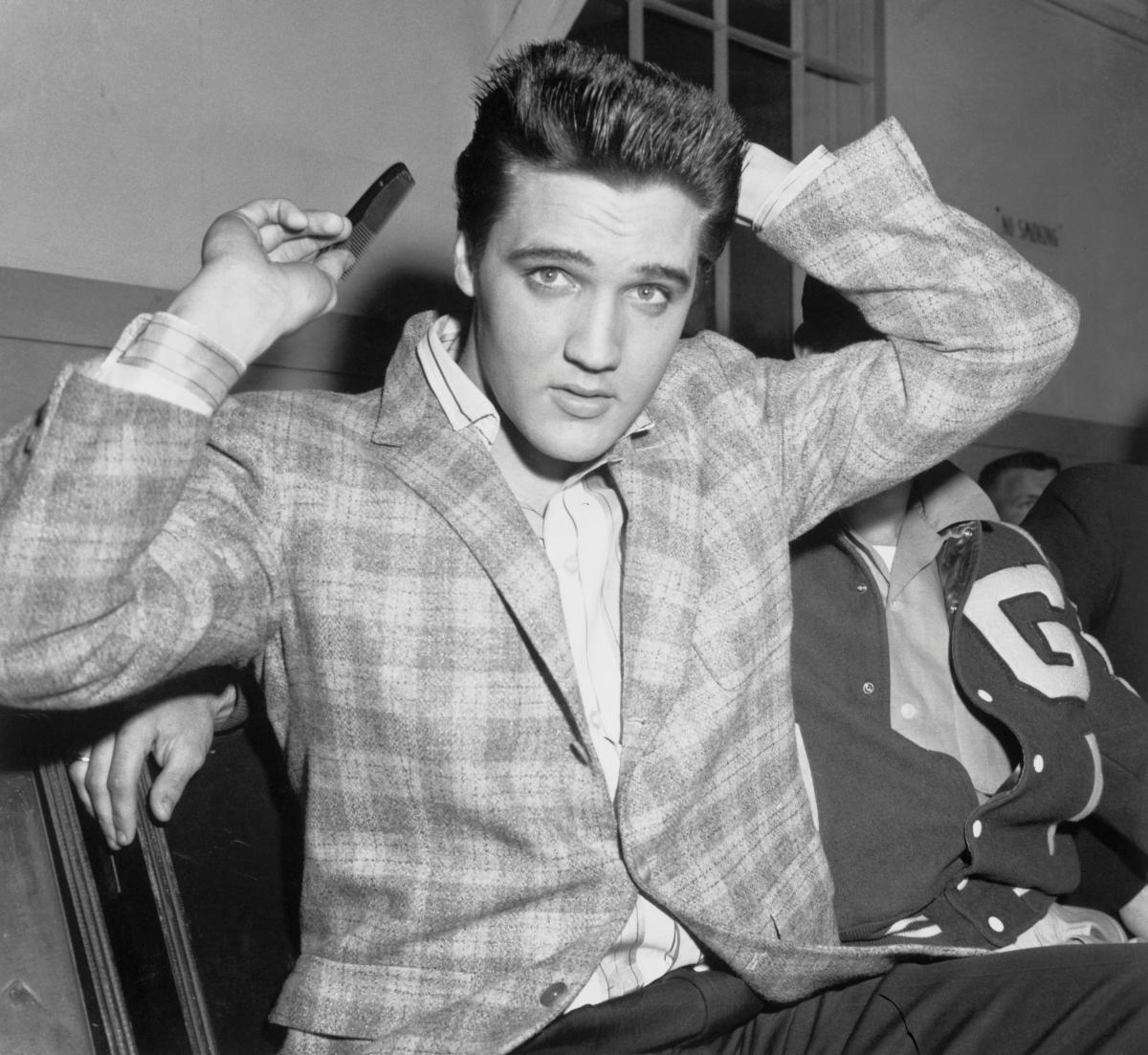 Elvis Presley Receives An Army Crew Cut by Bettmann