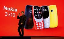 Arto Nummela, CEO of Nokia-HMD, holds up Nokia 3310 device during presentation ceremony at Mobile World Congress in Barcelona, Spain, February 26, 2017. REUTERS/Paul Hanna