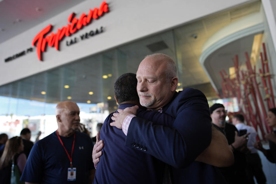 Tropicana general manager Airk Knowles, right, embraces an employee at the Tropicana hotel-casino after the property closed, Tuesday, April 2, 2024, in Las Vegas. The hotel-casino is slated for demolition in October to make room for a $1.5 billion baseball stadium. (AP Photo/John Locher)