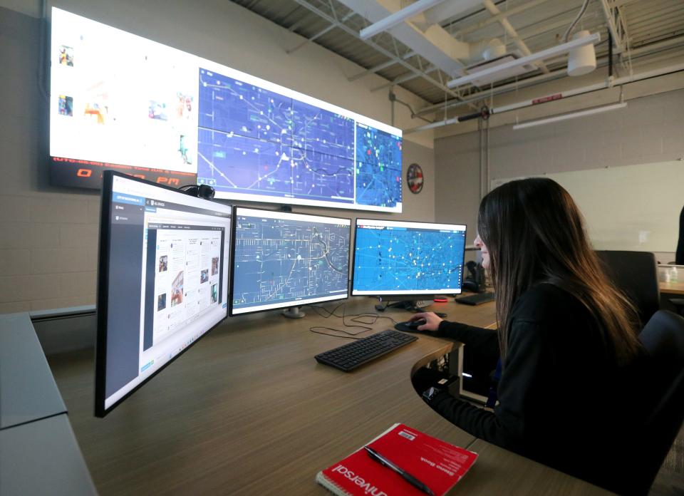 Josie Herman, crime analyst, sits at her desk Tuesday, Feb. 21, 2023, in the South Bend Police Department’s new Real Time Crime Center in the central police station.