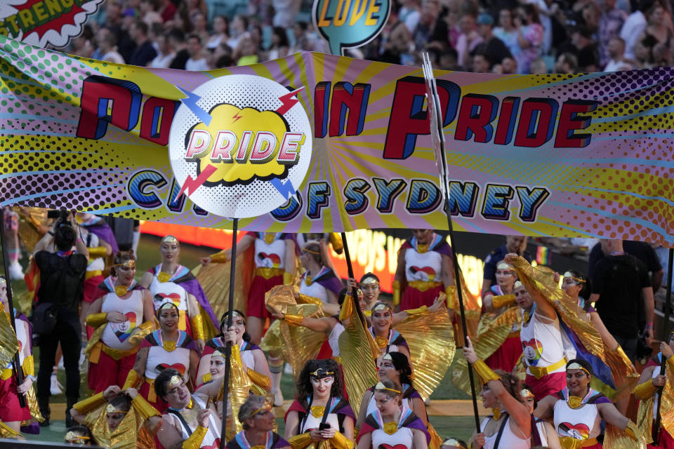 FILE - Participant march in the annual Gay and Lesbian Mardi Gras parade at the Sydney Cricket ground in Sydney, Saturday, March 5, 2022. Singapore’s announcement Sunday, Aug. 22, 2022, that it would decriminalize sex between men is being hailed as a step in the right direction for LGBTQ rights in the Asia-Pacific region, a vast area of nearly 5 billion people with different laws and attitudes. (AP Photo/Rick Rycroft, File)