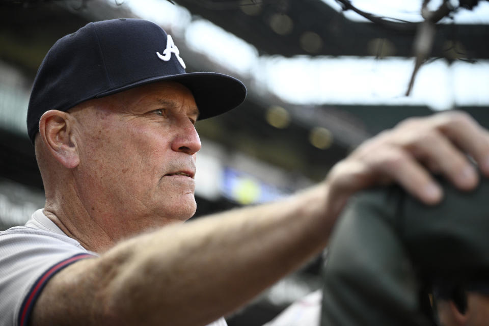 Atlanta Braves manager Brian Snitker watches from the dugout before the team's baseball game against the Baltimore Orioles, Wednesday, June 12, 2024, in Baltimore. (AP Photo/Nick Wass)