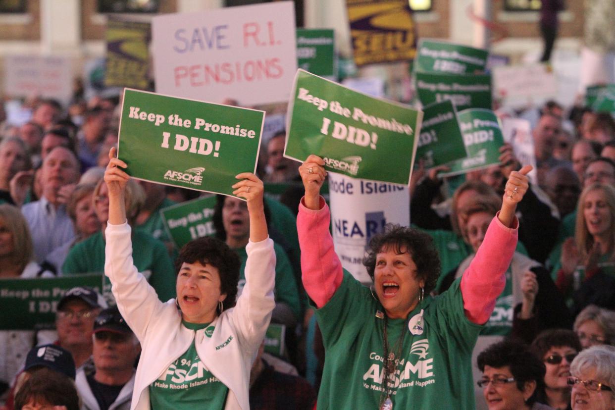 Union groups rally outside the Rhode Island State House in November 2011 to protest what they considered severe pension cuts.